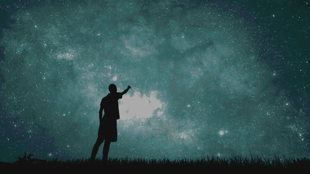 man looking at stars